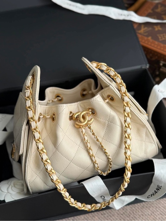 CHANEL Handbags - SOLD- CHANEL Mini Cream Quilted Drawstring Shoulder Bag with Gold Hardware